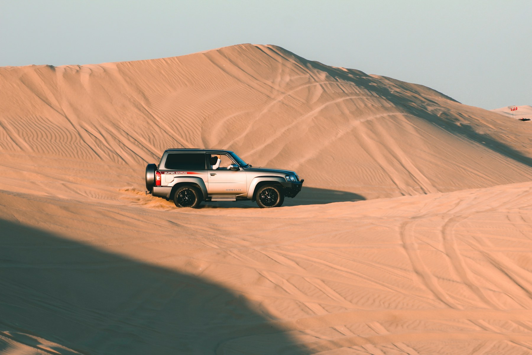 Premium SUV driving through the UAE desert
